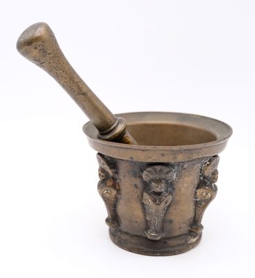 an old mortar with a wooden pestula in it on a white background