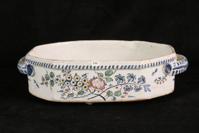 a white bowl with blue and yellow flowers on it