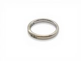 a close up of a ring on a white surface
