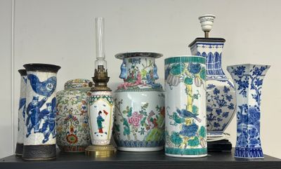 many vases sitting on a shelf in a room