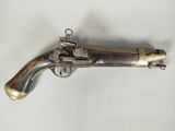 an old gun that is sitting on top of a table