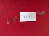 a label on a piece of red fabric that is taped to the wall