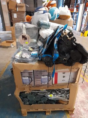a cart full of stuffed animals and other items in a warehouse