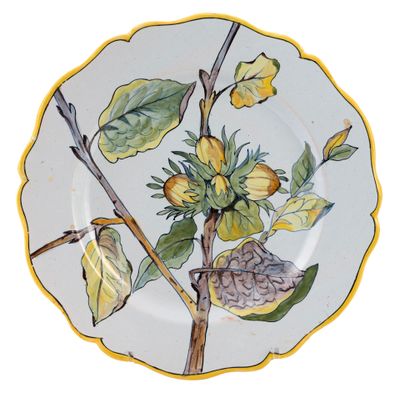 a plate with a painting of a bird on it