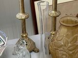 a table with a lot of glass and vases on it