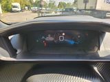 the dashboard of a car with a digital display on it