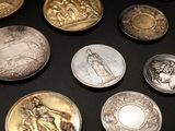 a lot of coins that are on a table