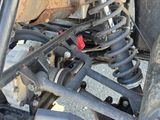 a close up of the front suspension of a vehicle