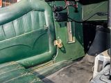 a green seat in the back of a green car