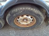 a flat tire on a truck with a chain around it