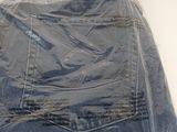 a picture of a pair of jeans wrapped in plastic