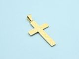 a close up of a gold cross on a blue surface