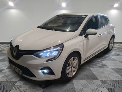 the white car is parked on a checkered tile floor