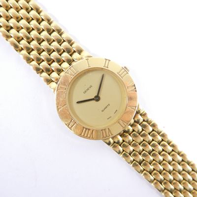 an image of a close up of a wrist watch on a white surface