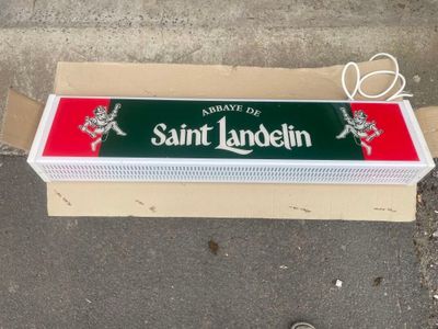 a cardboard box that has a sign on it