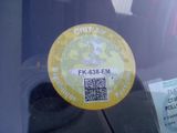 a sticker on the back of a car that has a qr code on it