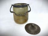a glass jar with a metal lid and a metal lid
