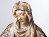 statue of a woman with a veil on her head in a white background