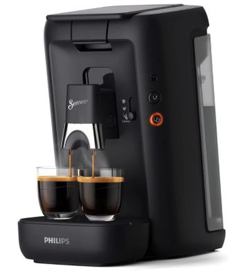 une machine à café noire avec deux tasses de café devant elle
