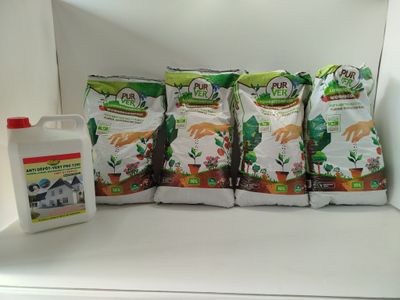 five bags of fertint sitting on a shelf next to a bottle of fertint and a container of fertint