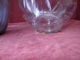 two vases that are sitting on a pink cloth