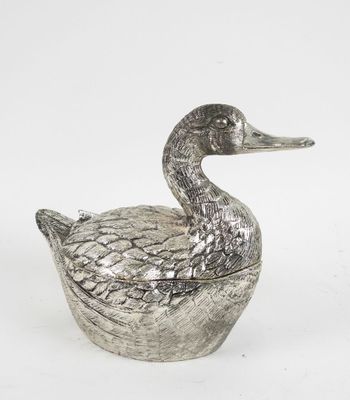 a silver duck shaped box sitting on top of a white surface