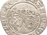 Gros plan sur une pièce de monnaie portant des armoiries