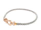 a close up of a bracelet with a clasp on a white background