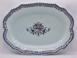 a blue and white plate with a floral design on it