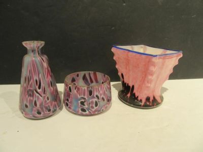 three vases sitting next to each other on a table