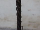 a wooden table with a spiral design on top of it