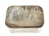 a silver box with a painting on it on a white surface