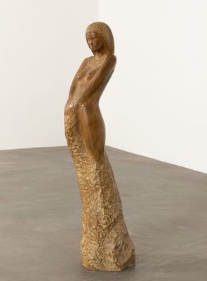 an image of a sculpture of a woman standing on a table