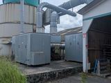 a large machine that is sitting outside of a building