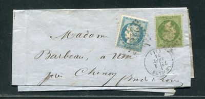 an old envelope with a stamp on it sitting on top of a table