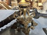 a small brass object on a table in a shop