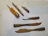 a lot of tools that are laying out on a piece of paper