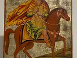 an image of a painting of a man riding a horse on a wall