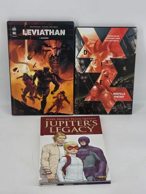 two comics are sitting on a table next to each other