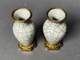 two vases that are sitting next to each other on a table