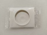 a small white object in a plastic bag on a table