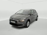 a grey citrole is parked in a white room