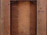 an old wooden door with a sign on the front of it