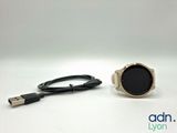 an image of a smart watch with a usb cable connected to it
