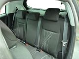 the back seats of a car with two rows of seats in it