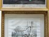 two framed pictures of people in a room with a dog