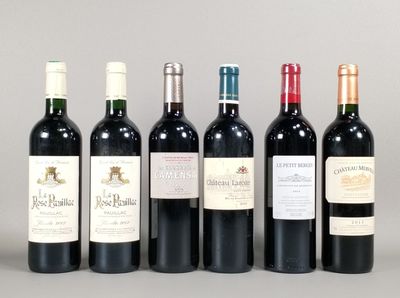 six bottles of wine are lined up in a row on a table