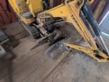 a picture of a construction vehicle parked in a garage