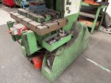 a machine that is sitting on the ground in the garage