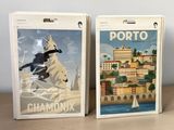 two boxes that have a picture of a city on them